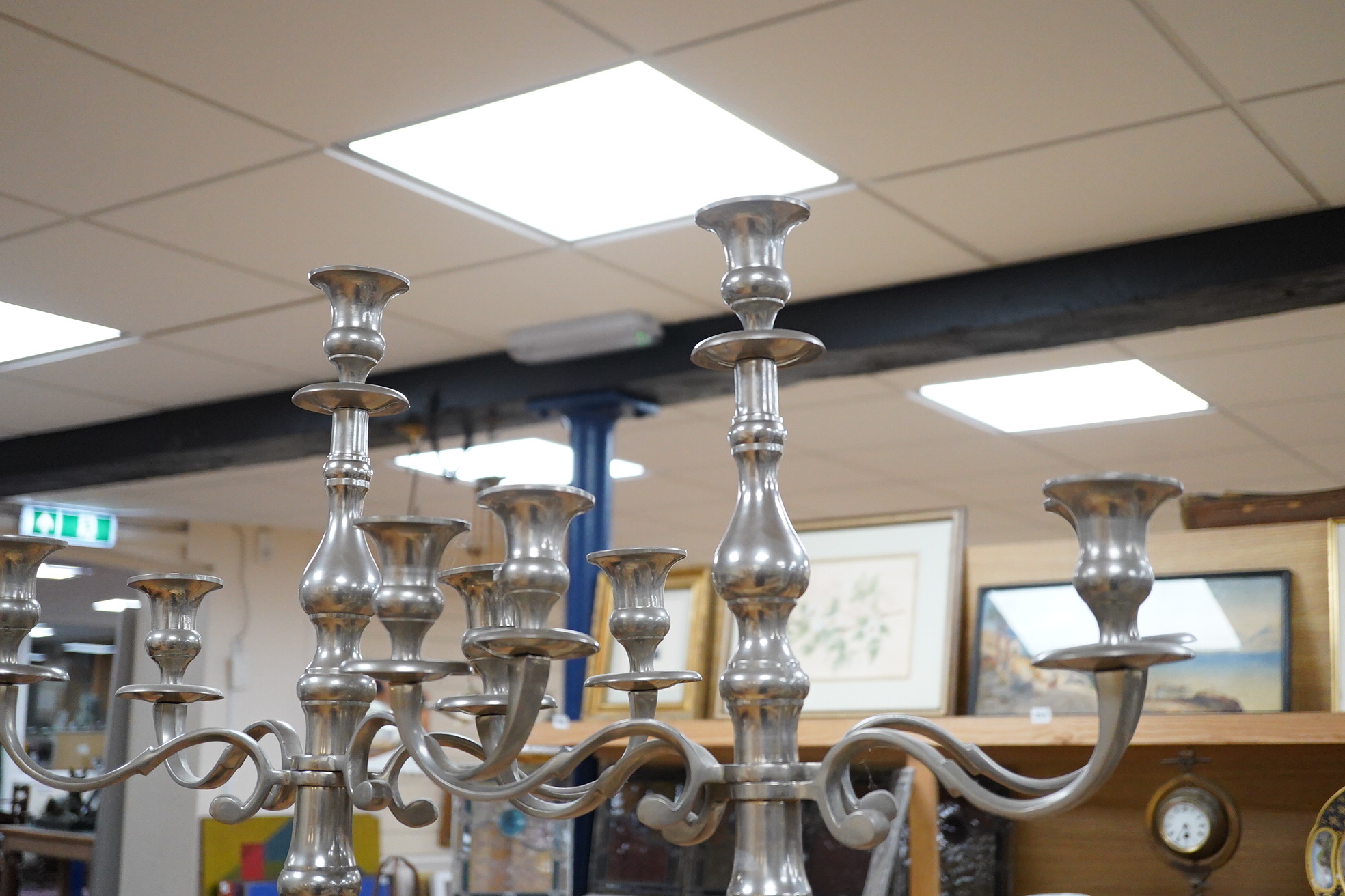 A pair of tall pewter four branch, five light candelabra, 105cm high
